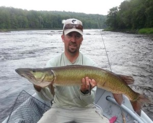 Dan Boggs of Blackwater Fly Fishing with a 40″ Muskellunge on the Wisconsin River.
