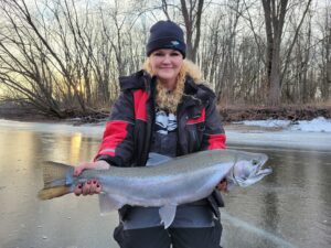 Carrie Zylka - HuntFishTravel Podcast Steelhead caught through the ice in Wisconsin.